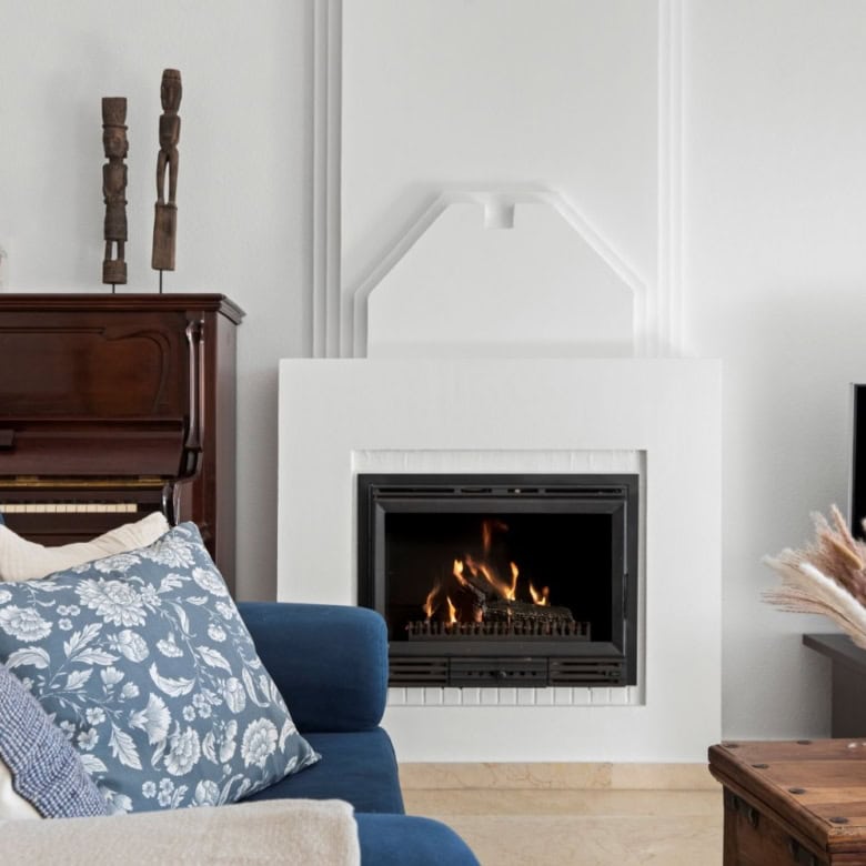 Elegant living room with modern fireplace and stylish decor in Dominion Beach property.