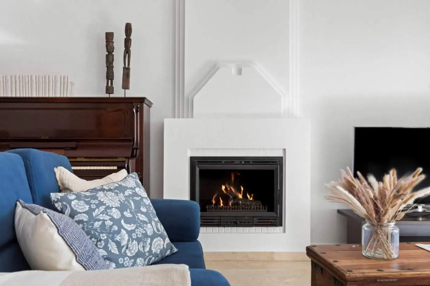 Elegant living room with modern fireplace and stylish decor in Dominion Beach property.