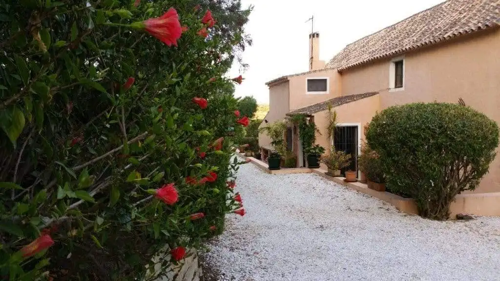 Beautiful view of a traditional Spanish finca with lush greenery in Estepona, Spain.