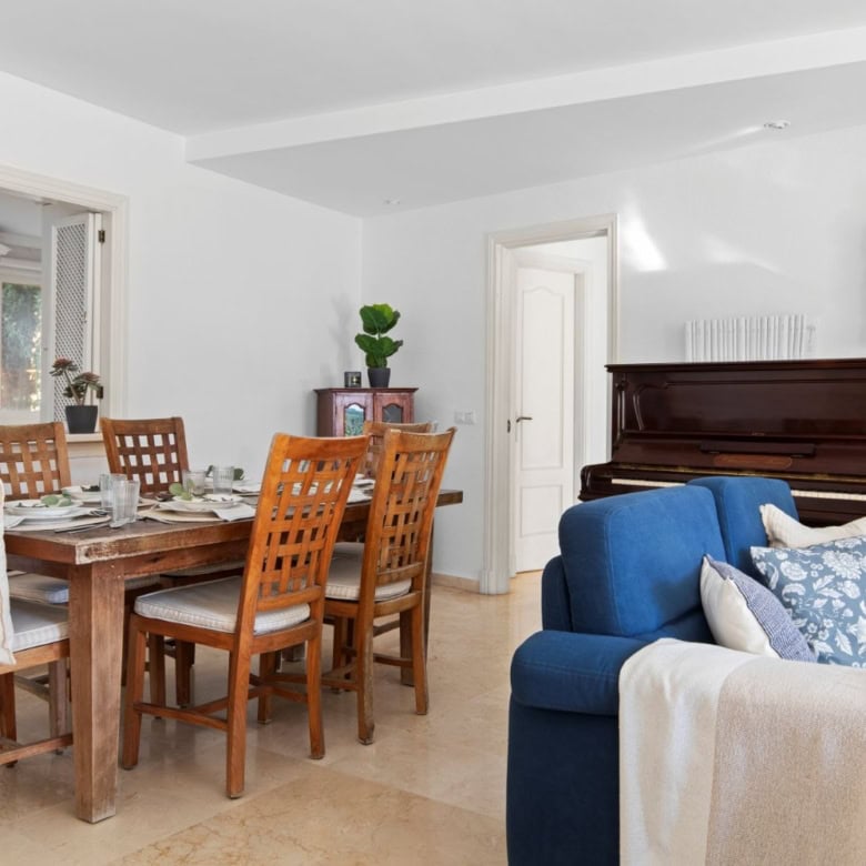 Elegant living and dining area with ocean views in Dominion Beach.