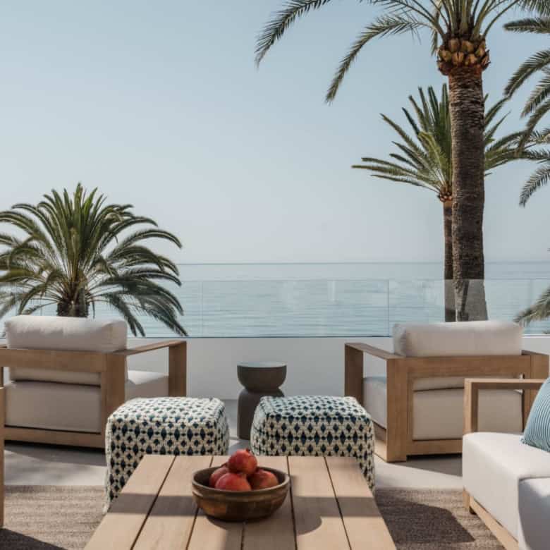 Beachfront terrace with seating and ocean view in Marbella Golden Mile.