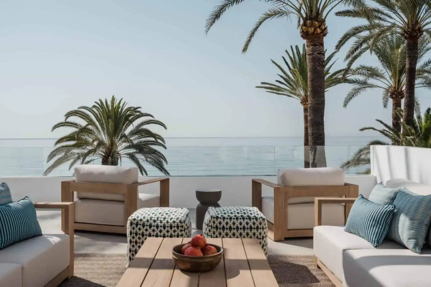 Beachfront terrace with seating and ocean view in Marbella Golden Mile.