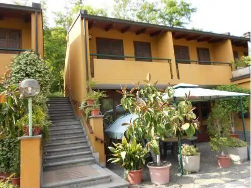 Hotel on Lake Viverone with scenic views and lush gardens in Piverone, Torino, Italy.