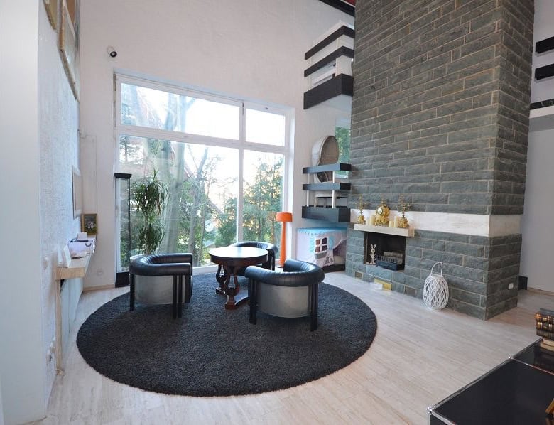 Spacious living room with modern decor, large windows, and cozy seating in Bad Harzburg, Niedersachs.