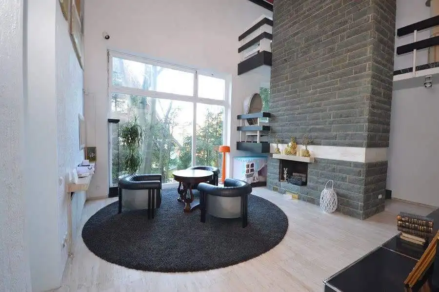 Spacious living room with modern decor, large windows, and cozy seating in Bad Harzburg, Niedersachs.