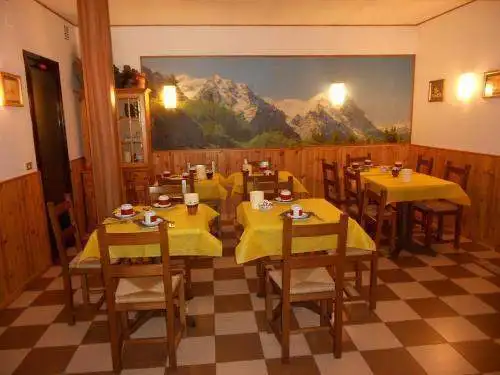 Charming hotel dining room with mountain view near Lake Viverone in Piverone, Italy. Perfect for rel.