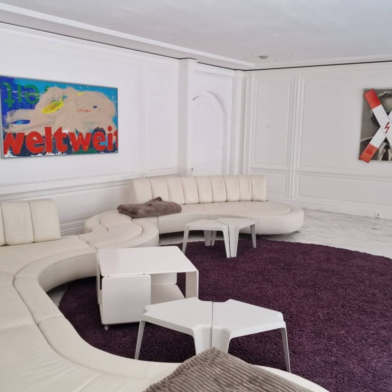 Interior view of a modern, spacious living room in a luxury 6-bedroom villa in Bad Harzburg, Germany.