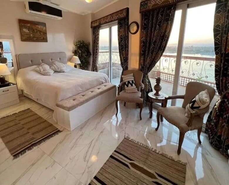 Elegant bedroom with large windows and scenic views in Derrymore County Clare.