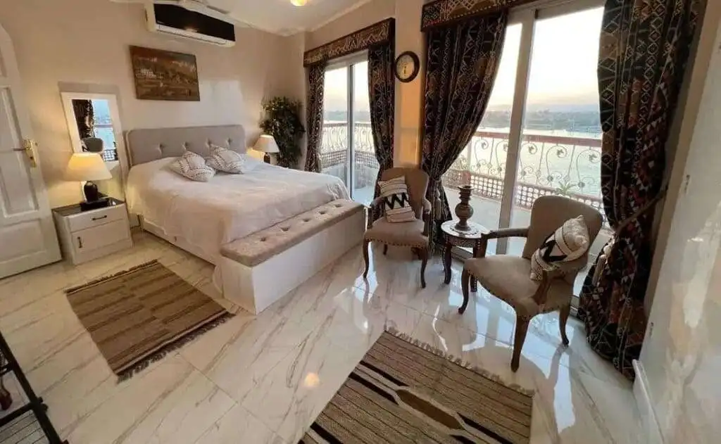 Elegant bedroom with large windows and scenic views in Derrymore County Clare.