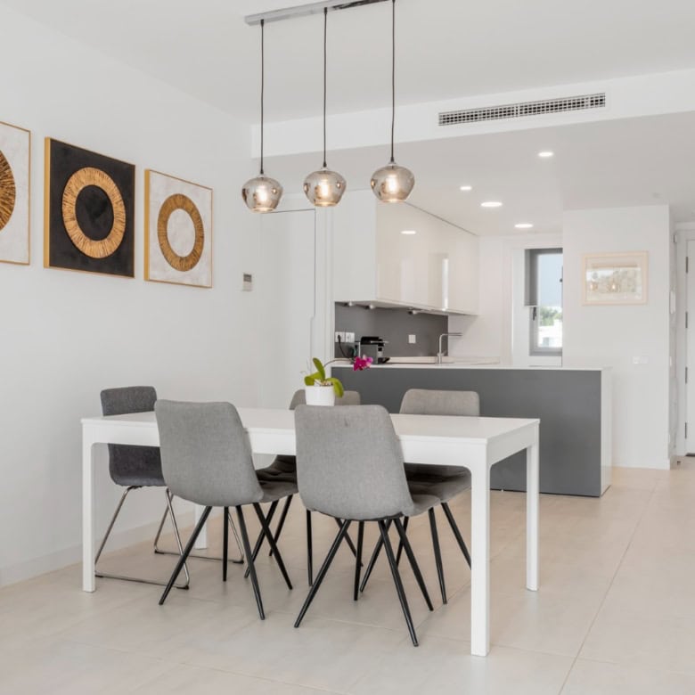 Bright, modern dining area in a spacious penthouse in Selwo Estepona.