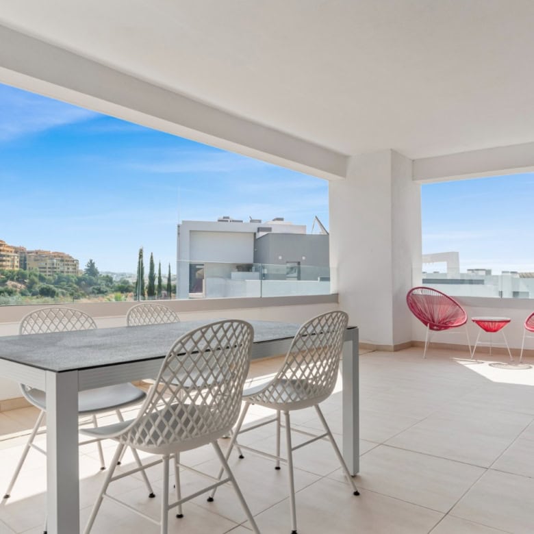 Spacious balcony of a fully furnished modern penthouse with seating area and panoramic views in Selw.