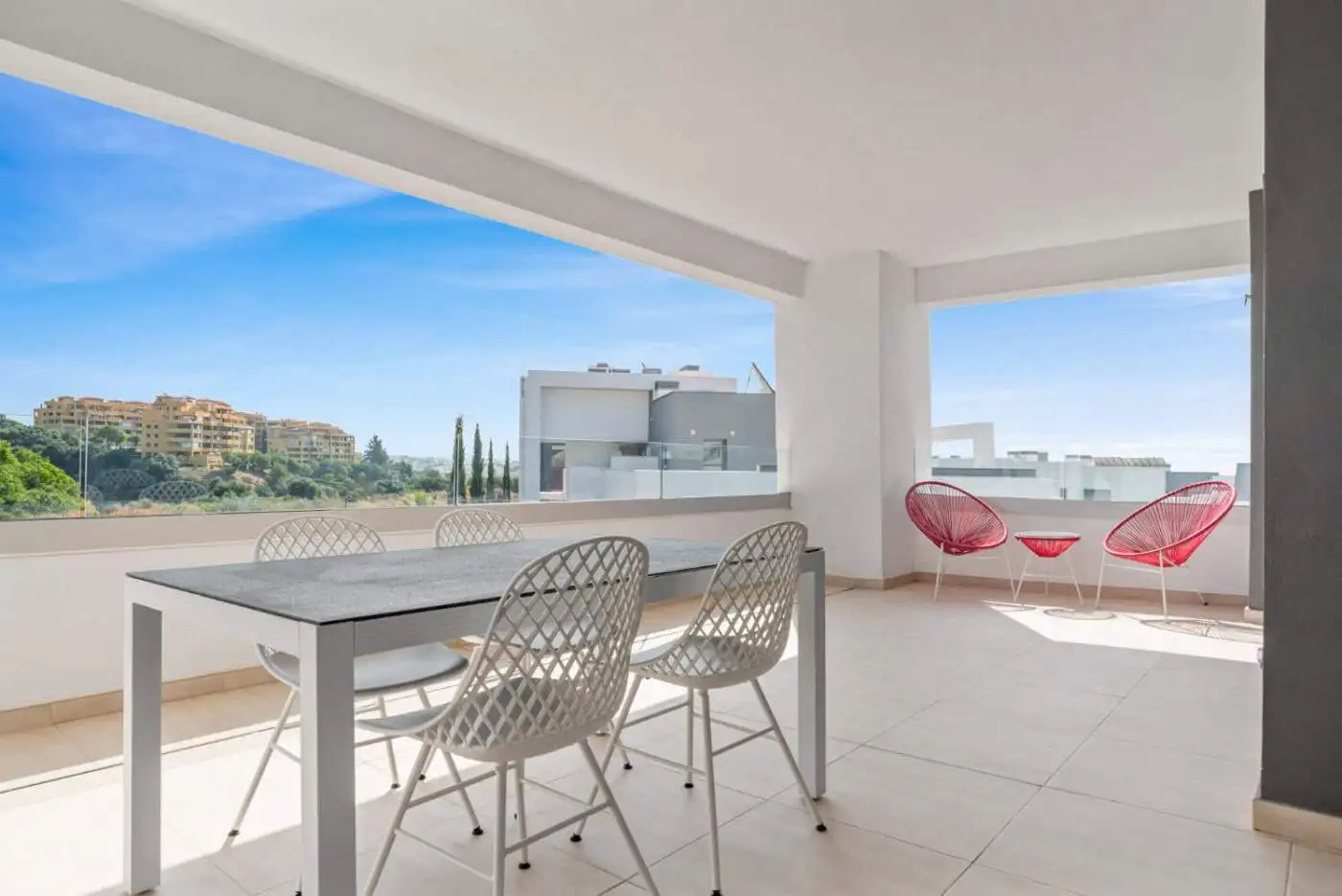 Spacious balcony of a fully furnished modern penthouse with seating area and panoramic views in Selw.