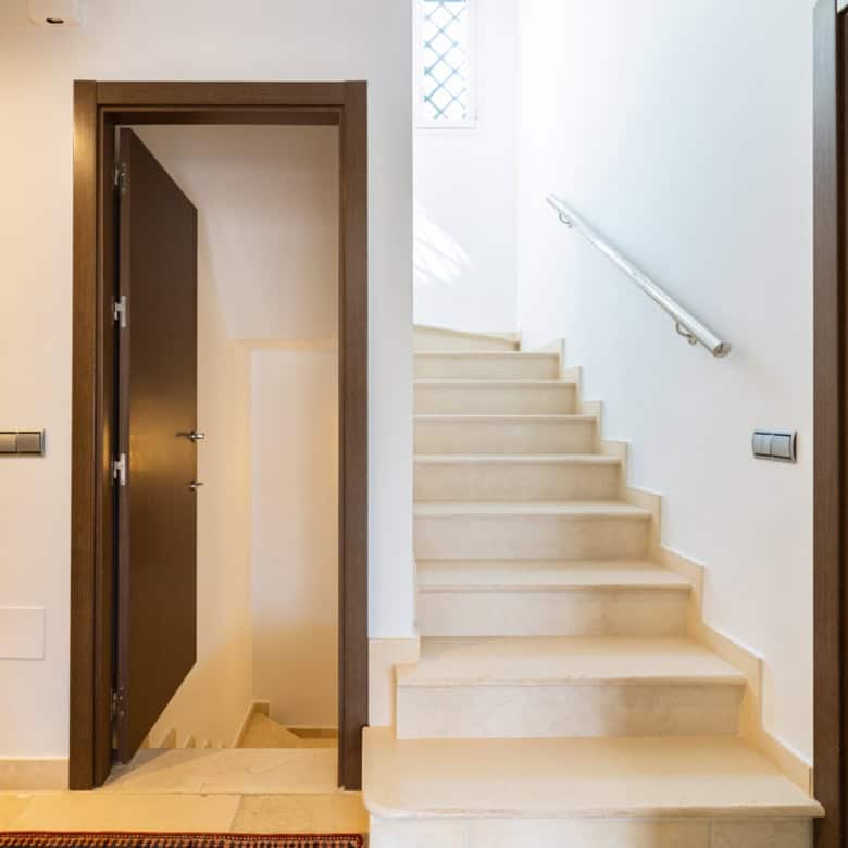 Refurbished townhouse interior with staircase and modern decor in Brisas del Sur, Nueva Andalucía.