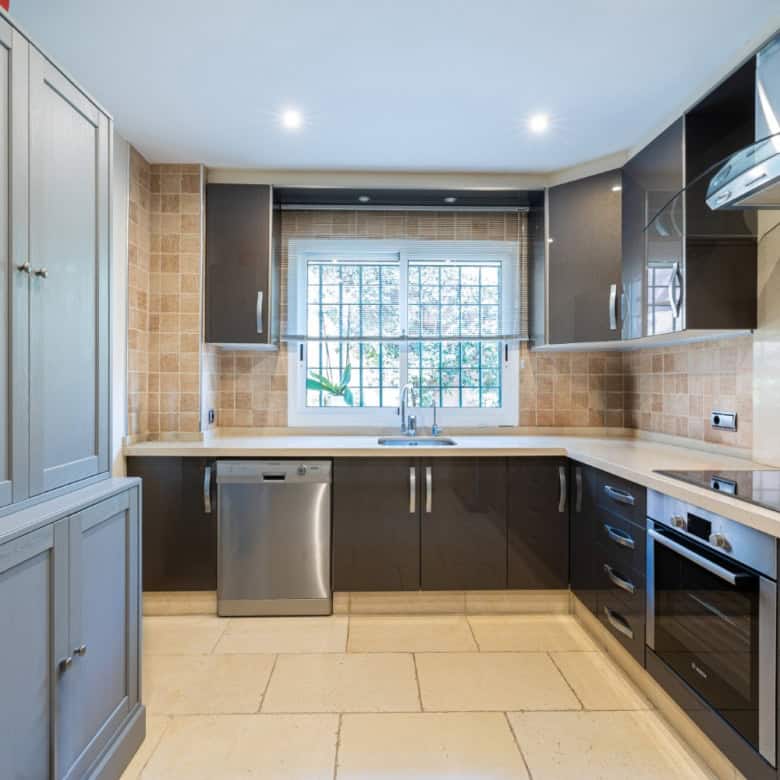 Modern kitchen with sleek cabinetry and stainless steel appliances.