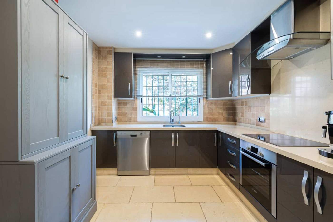 Modern kitchen with sleek cabinetry and stainless steel appliances. Modern kitchen with sleek cabinetry and stainless steel appliances.