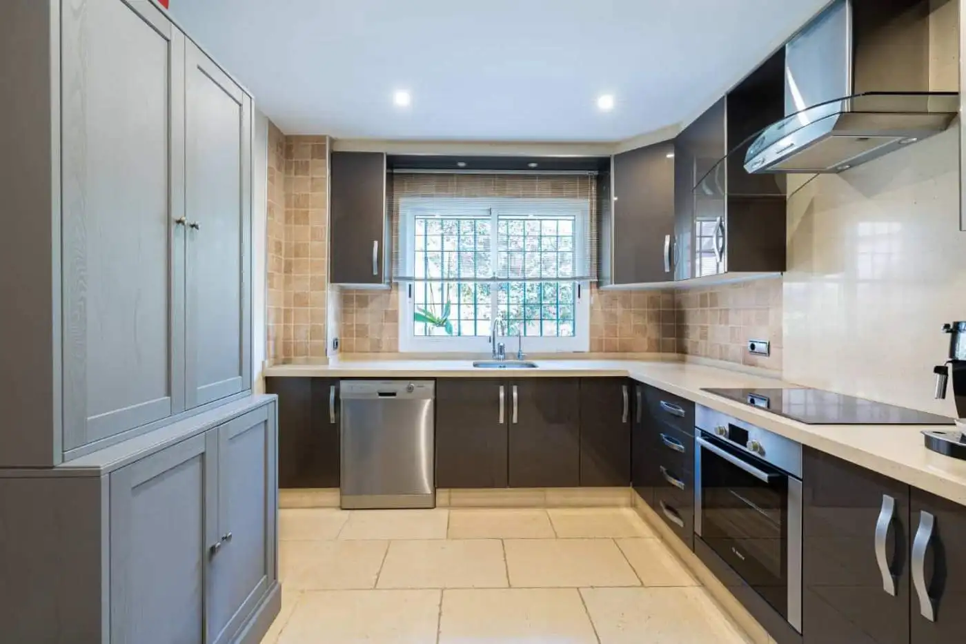 Modern kitchen with sleek cabinetry and stainless steel appliances.