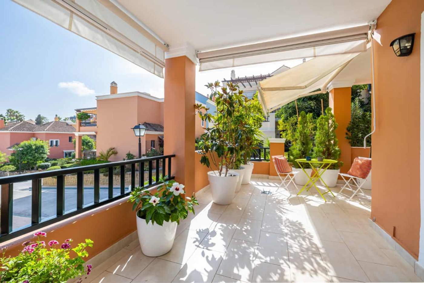 Refurbished Townhouse Balcony in Brisas del Sur Balcony of a refurbished townhouse in Brisas del Sur, Nueva Andalucía, featuring outdoor seating and.