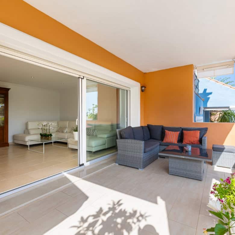 Spacious terrace of a refurbished townhouse in Brisas del Sur, offering outdoor seating and garden v.