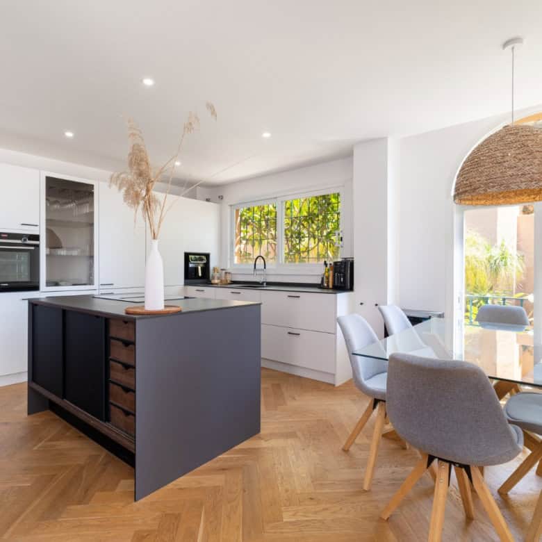 Stylish penthouse kitchen with modern appliances and bright open-plan design.