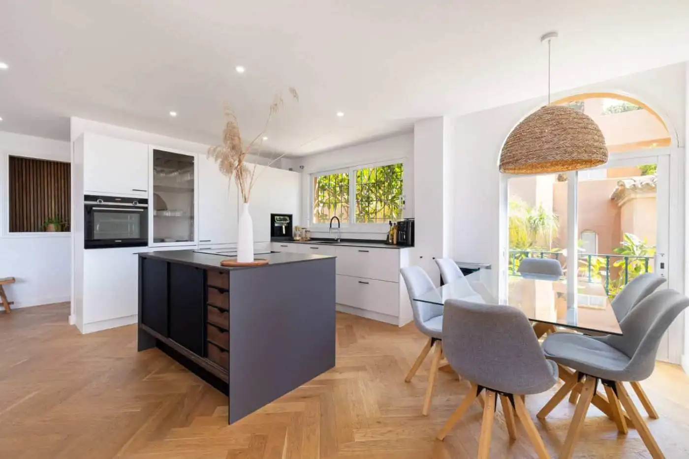 Stylish penthouse kitchen with modern appliances and bright open-plan design.