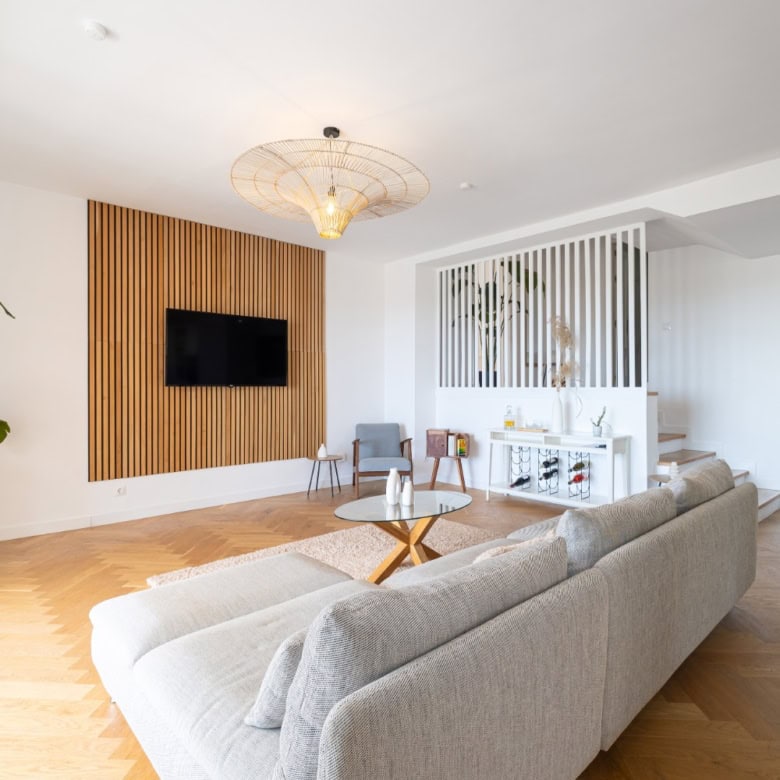 Penthouse living room with modern decor and panoramic south views.