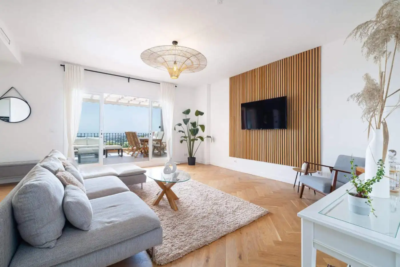 Luxurious penthouse interior with modern decor and panoramic south-facing windows.