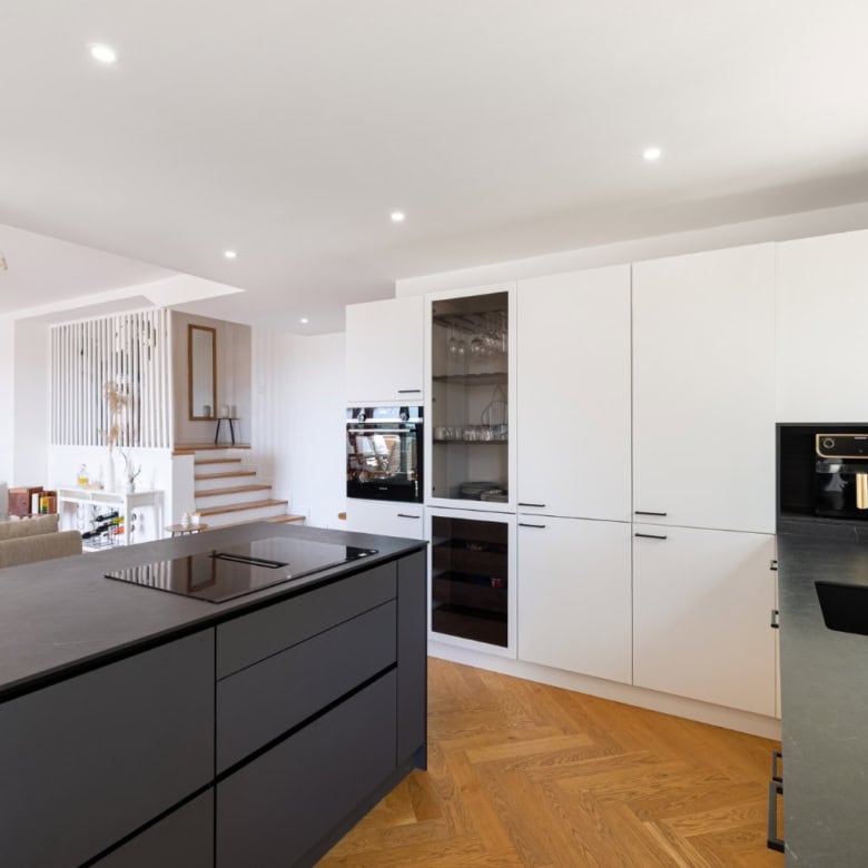 Stylish penthouse kitchen with modern appliances and sleek design.