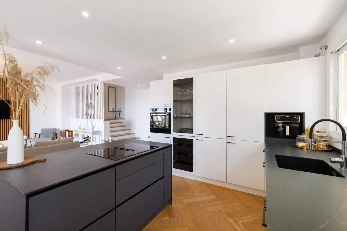 Stylish penthouse kitchen with modern appliances and sleek design.