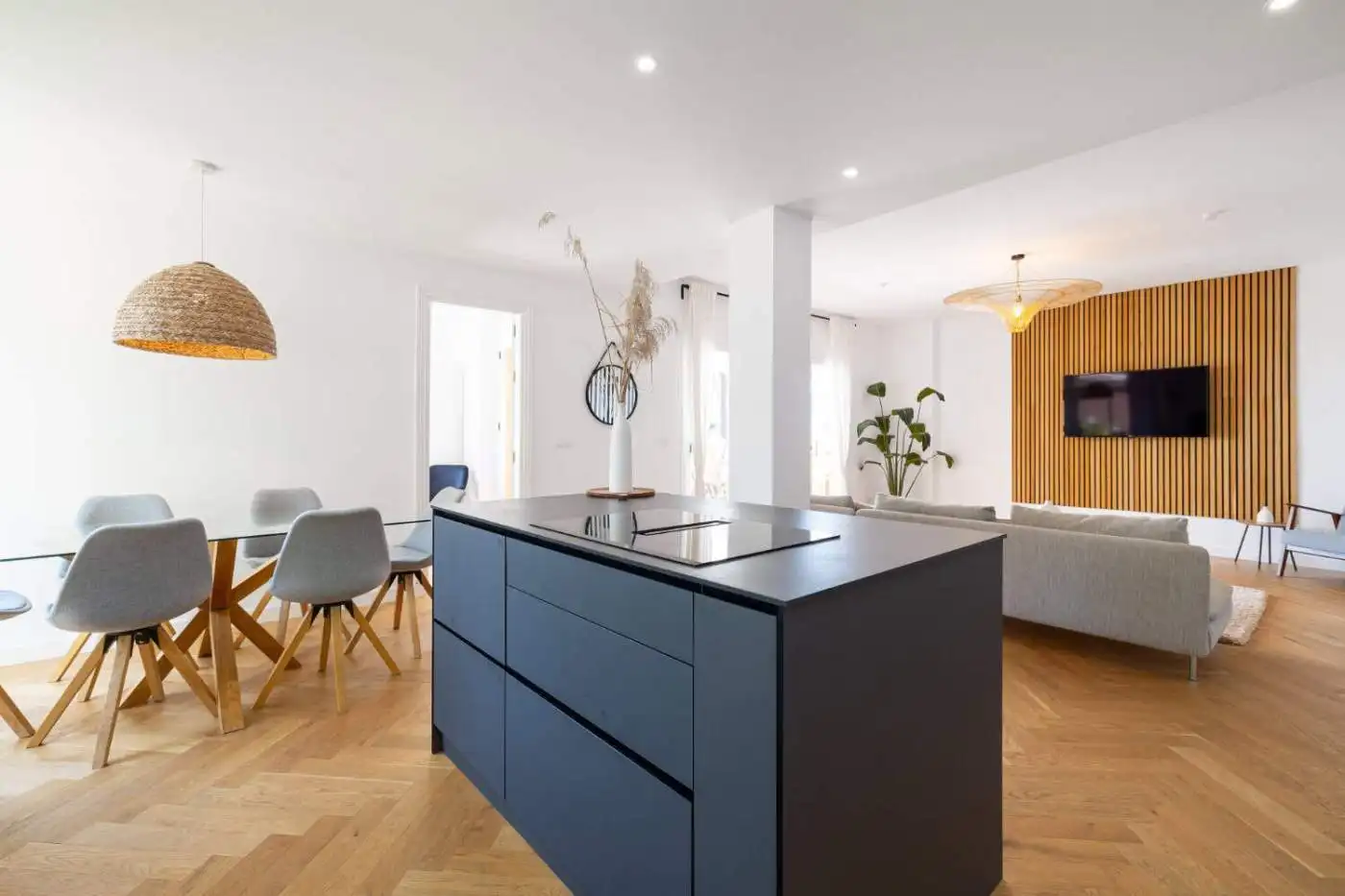 Stylish penthouse interior with modern decor and expansive south-facing panoramic windows.