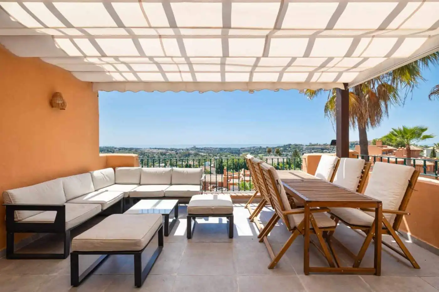 Luxurious penthouse with south-facing panoramic city views and stylish outdoor seating area.