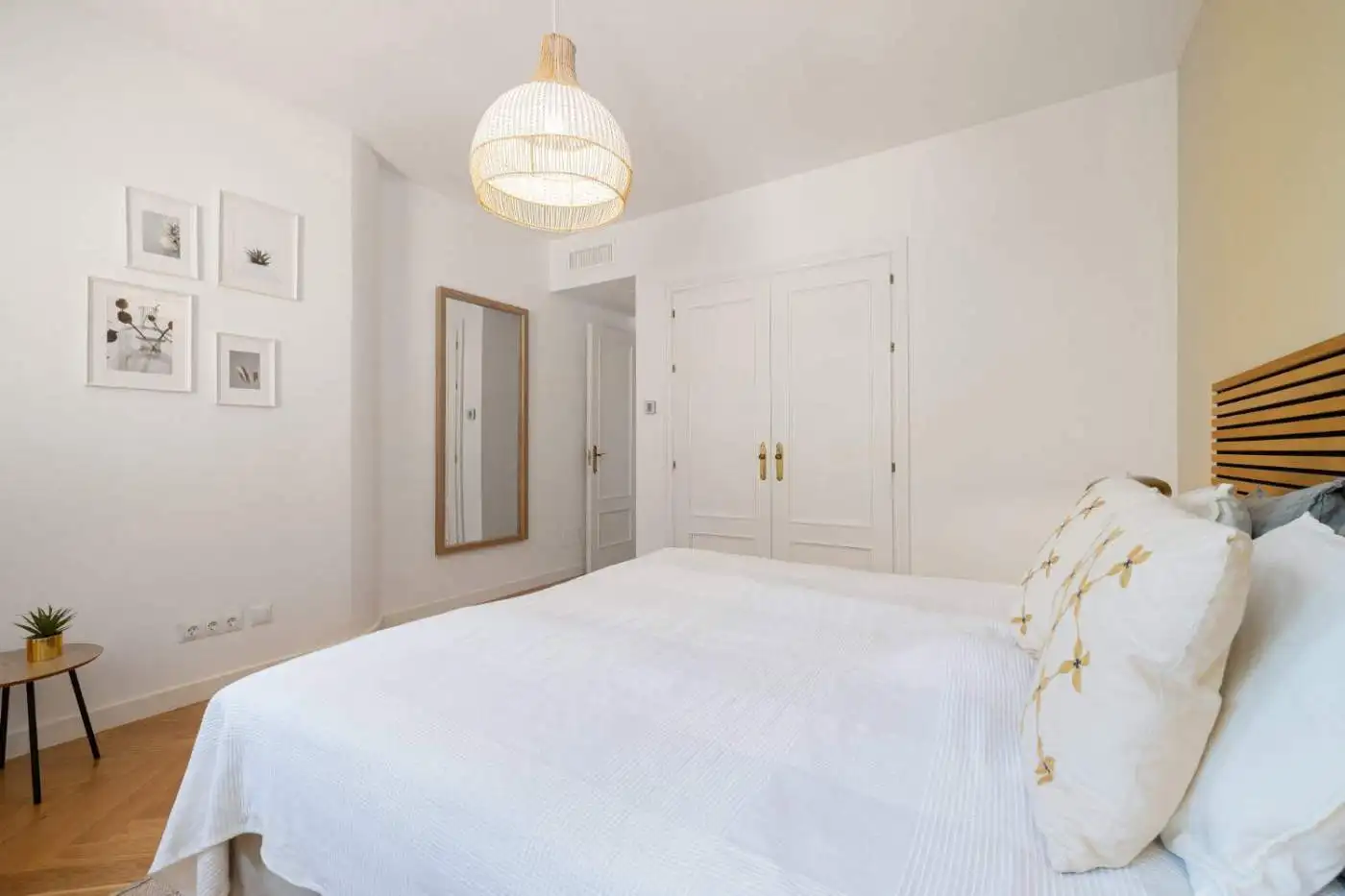 Bright, modern bedroom with panoramic south-facing windows and stylish decor.