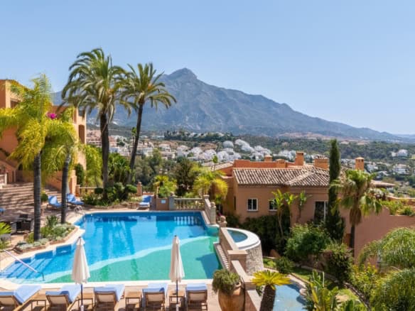  penthouse with stunning south-facing panoramic mountain and city views, featuring a privat.