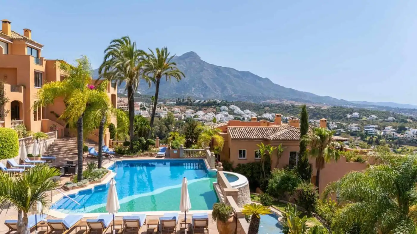 Luxurious penthouse with stunning south-facing panoramic mountain and city views, featuring a privat.