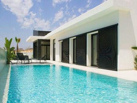 Luxury villa with private pool and outdoor seating in La Marina. Perfect for relaxing and enjoying s.