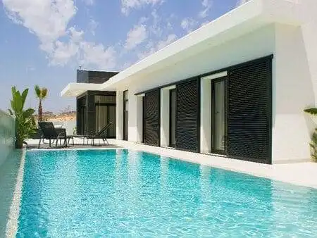 Luxury villa with private pool and outdoor seating in La Marina. Perfect for relaxing and enjoying s.