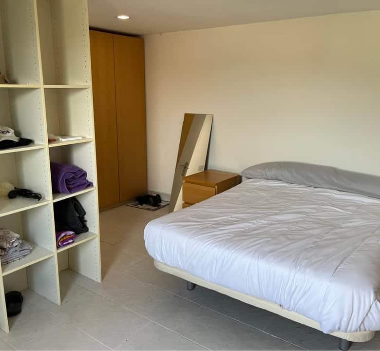 Comfortable bedroom with a double bed in a static mobile home at Camping Castillejo Fortuna Spain.