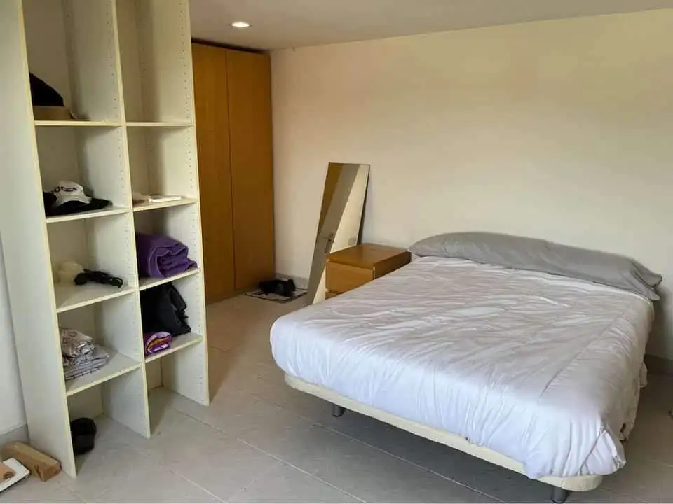 Comfortable bedroom with a double bed in a static mobile home at Camping Castillejo Fortuna Spain.