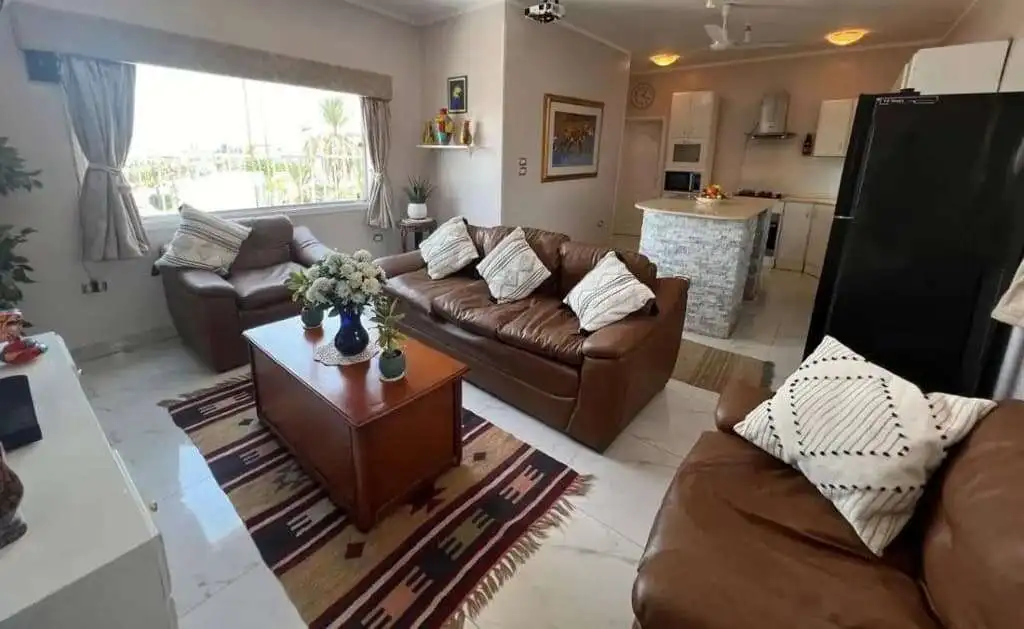 Spacious living room with comfortable sofas, modern decor, and natural light in Derrymore County Cla.