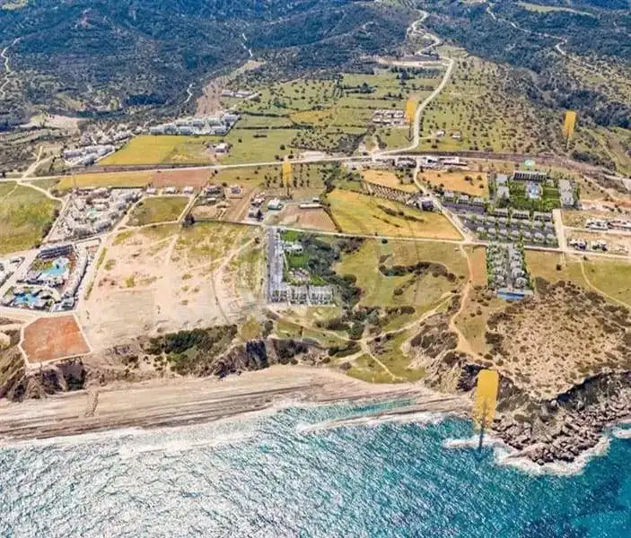 Aerial view of Deja Blue complex with coastline and surrounding landscape in North Cyprus.
