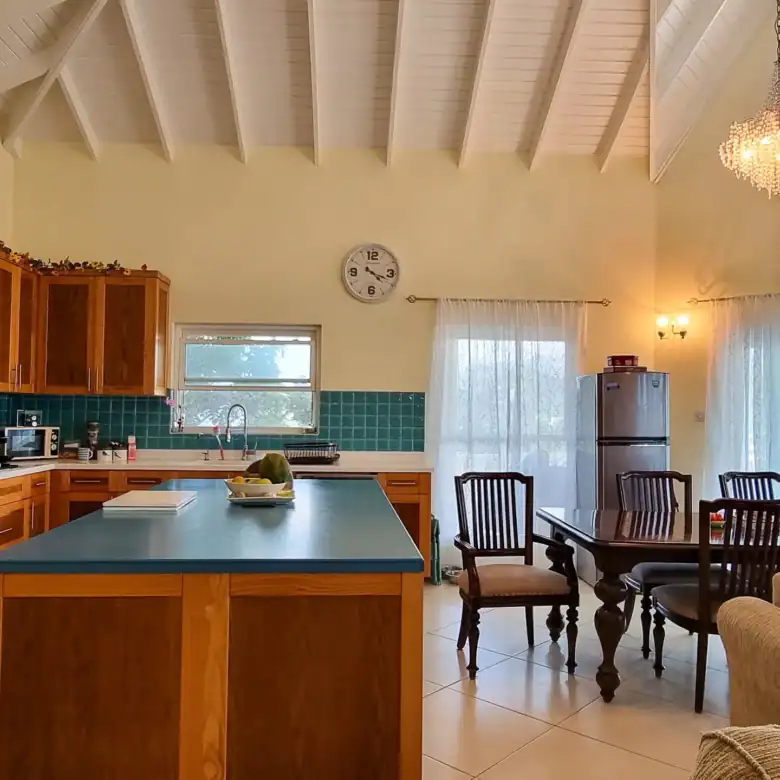Spacious kitchen and dining area in a luxury villa in Saint George, Grenada Caribbean.
