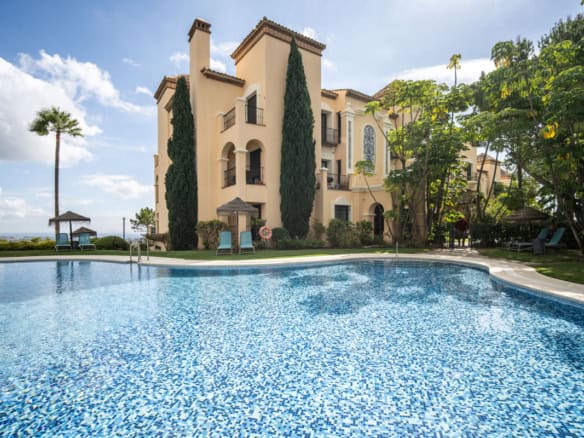 Elegant penthouse in Benahavís with private pool, lush gardens, and stunning Costa del Sol views.