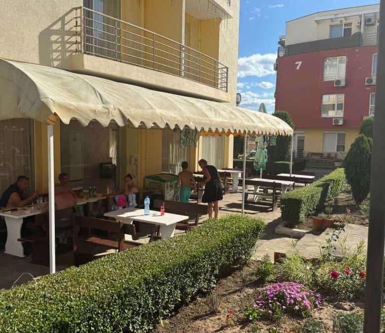 Outdoor seating area of a modern furnished apartment in Sunny Day 5, Bulgaria.