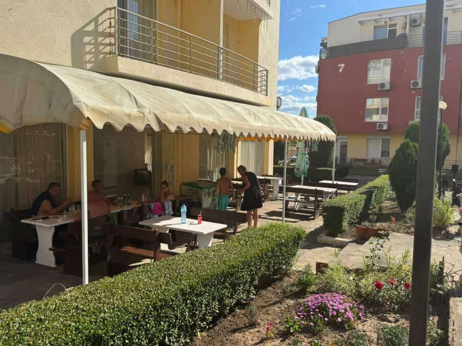 Outdoor seating area of a modern furnished apartment in Sunny Day 5, Bulgaria.