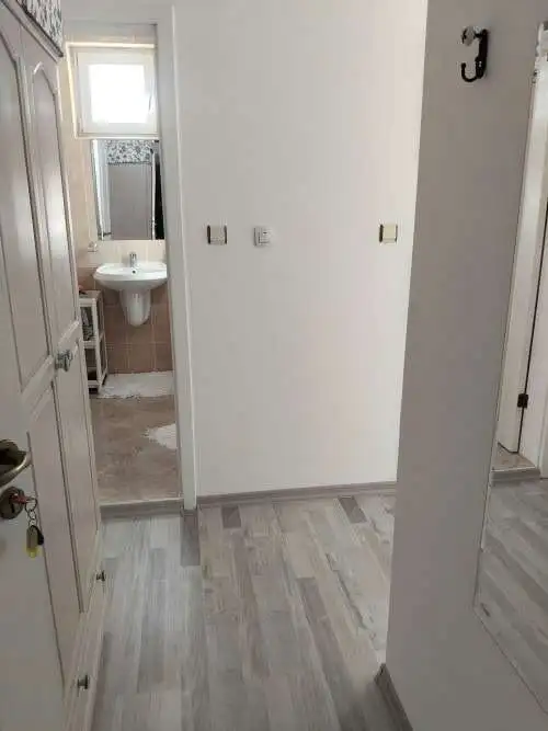 Interior view of a modern furnished apartment in Sunny Day 5, near bathroom.
