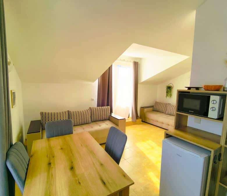 Bright interior of a 1-bedroom apartment near the sea in Sveti Vlas, featuring modern furnishings an.