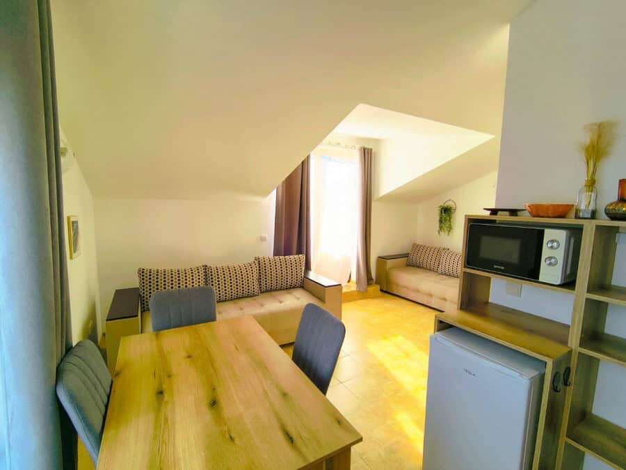 Bright interior of a 1-bedroom apartment near the sea in Sveti Vlas, featuring modern furnishings an.