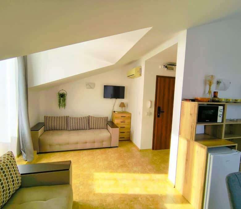 Bright interior of a 1-bedroom elegant apartment near the sea in Sveti Vlas, featuring modern furnis.