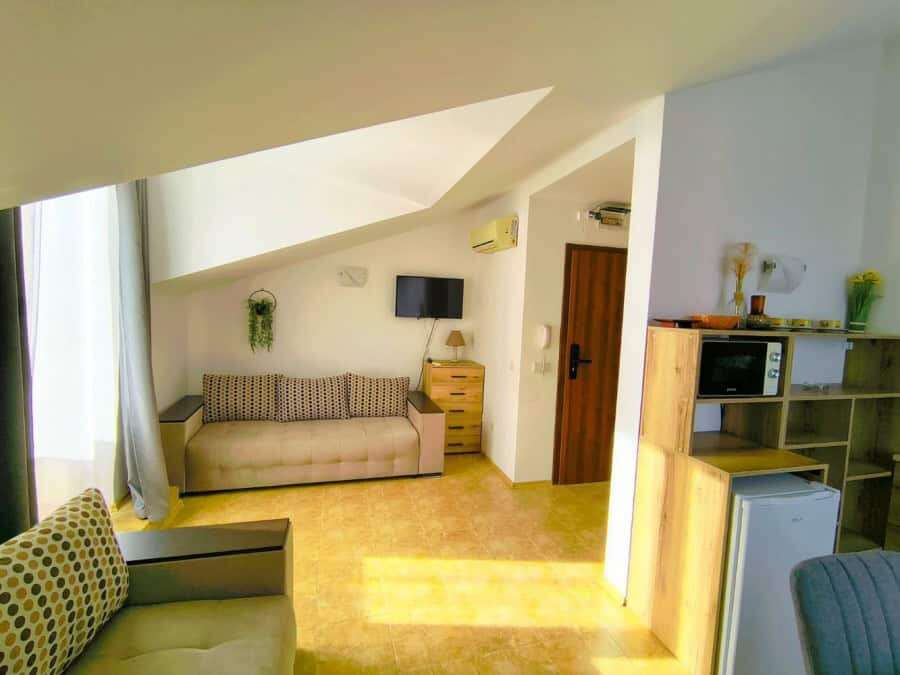 Bright interior of a 1-bedroom elegant apartment near the sea in Sveti Vlas, featuring modern furnis.