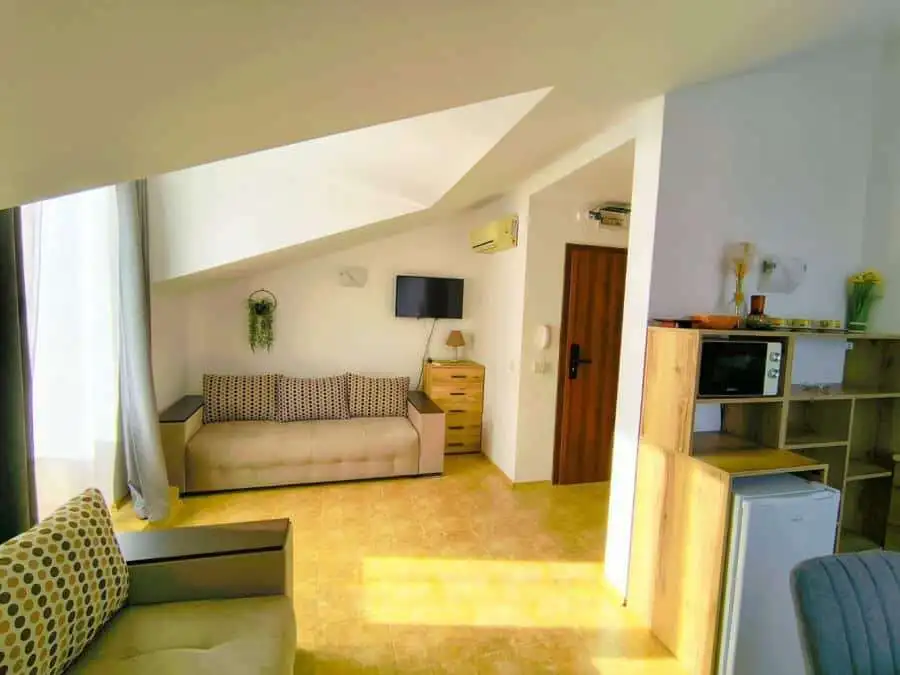 Bright interior of a 1-bedroom elegant apartment near the sea in Sveti Vlas, featuring modern furnis.