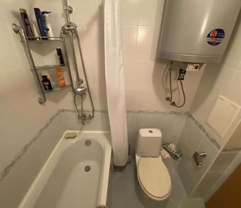 Bathroom with bathtub, shower, and water heater in Vineyards SPA Resort.